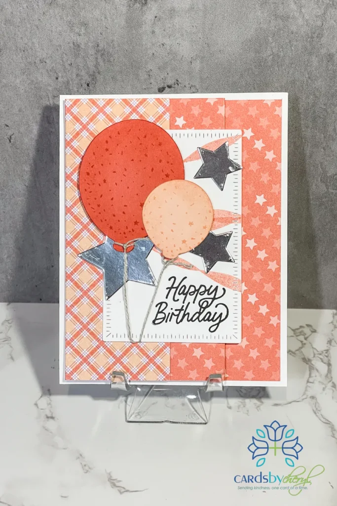 A birthday card with orange balloons