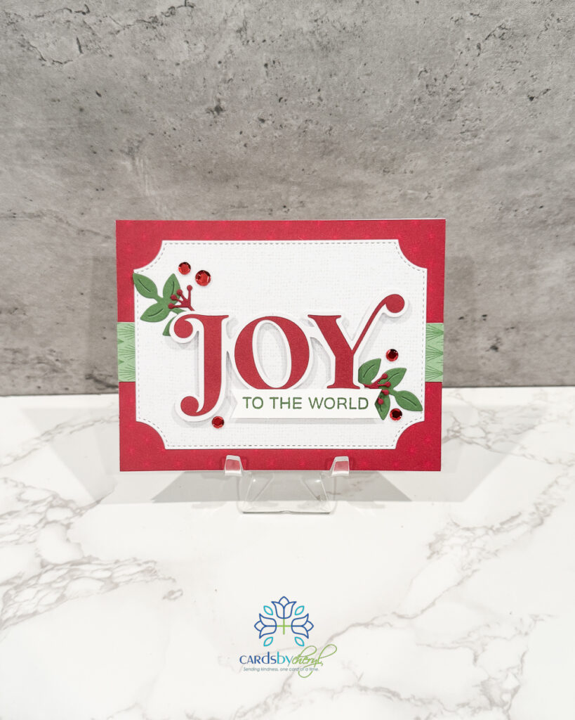 A festive Christmas card that says "Joy"