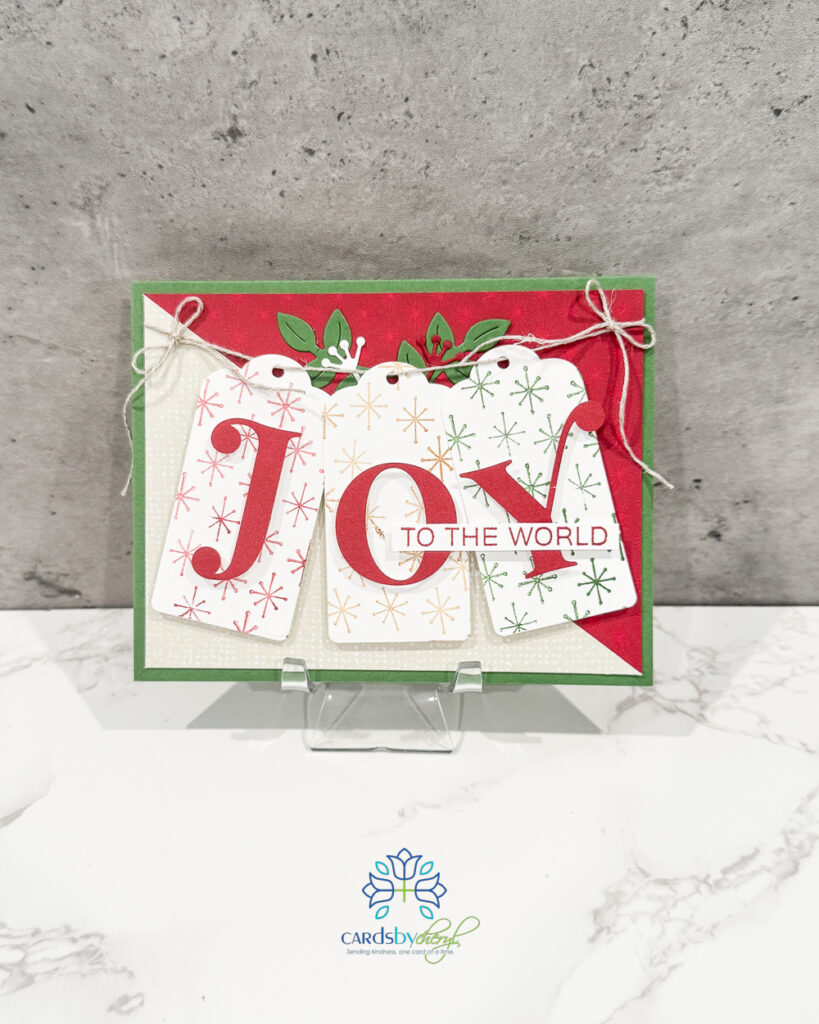 A festive Christmas card that says "Joy"
