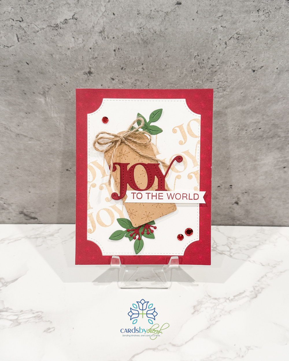 A festive Christmas card that says "Joy"